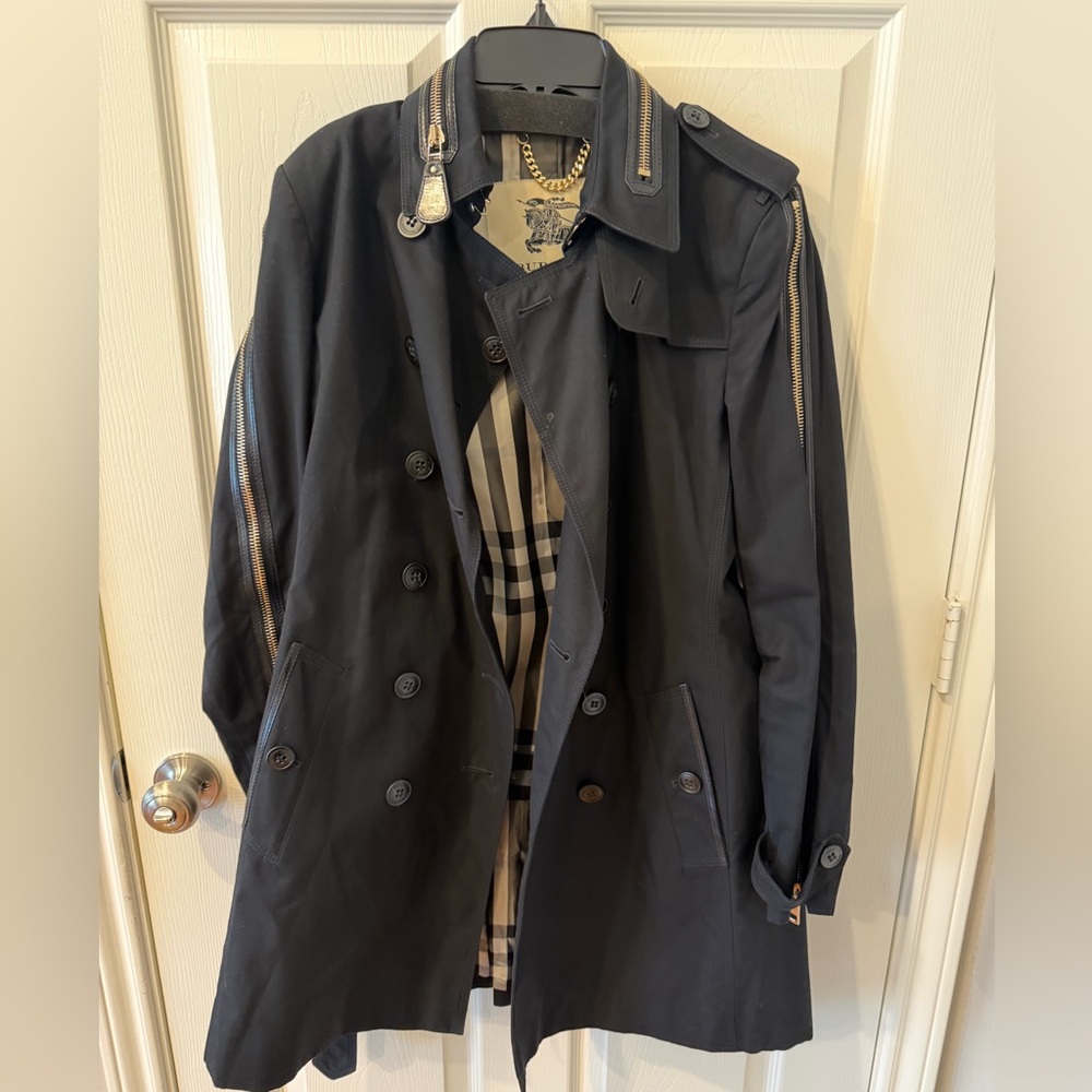 Burberry black women’s trenchcoat with leather and zippers accents